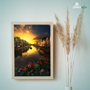 A stunning sunset over Amsterdam, showcasing the city's iconic architecture and serene canals in the heart of Europe.